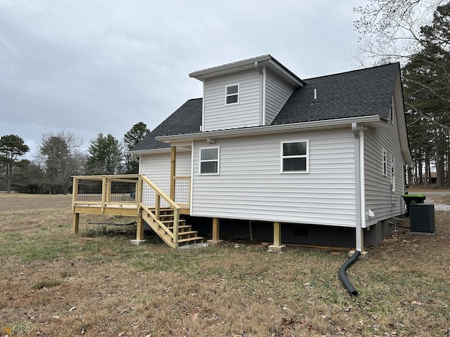 1679 Rock Rd, Mount Airy, GA 30563 - rear view of property featuring a deck, roof with shingles, and central AC