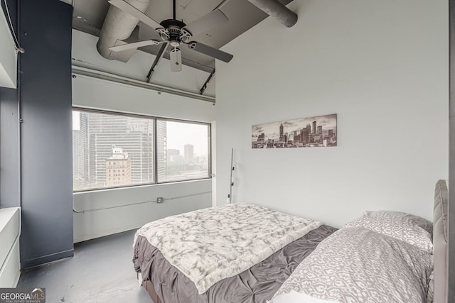 120 Ralph Mcgill Blvd NE Unit 1502, Atlanta, GA 30308 - bedroom featuring finished concrete flooring, high vaulted ceiling, beamed ceiling, and ceiling fan