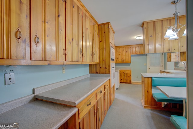 25 Ridge Dr SW, Rome, GA 30165 - kitchen with white appliances, light countertops, pendant lighting, and light carpet