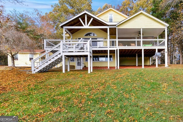 557 Hidden Pines Ct, Hiawassee, GA 30546 - back of house with ceiling fan, a lawn, stairs, and a wooden deck