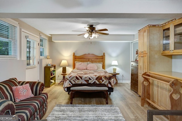 557 Hidden Pines Ct, Hiawassee, GA 30546 - bedroom featuring light wood-type flooring, ceiling fan, and baseboards