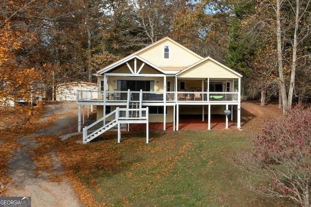 557 Hidden Pines Ct, Hiawassee, GA 30546 - view of front of house with stairway, a front lawn, and a deck