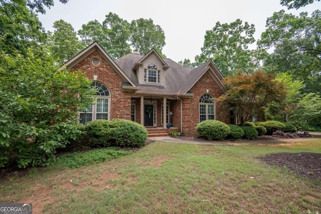 1151 Holcomb Ct, Bogart, GA 30622 - traditional-style house with brick siding, a front yard, and roof with shingles