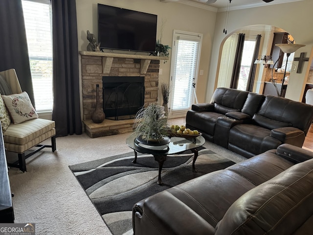 860 Nevis Way, Mcdonough, GA 30253 - living area with carpet, ornamental molding, a fireplace, arched walkways, and ceiling fan