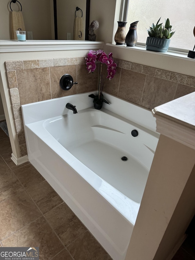 860 Nevis Way, Mcdonough, GA 30253 - bathroom featuring a bath and tile patterned floors