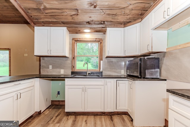 5198 Hwy 52 E, Ellijay, GA 30536 - kitchen featuring a sink, wooden ceiling, light wood finished floors, white cabinets, and decorative backsplash