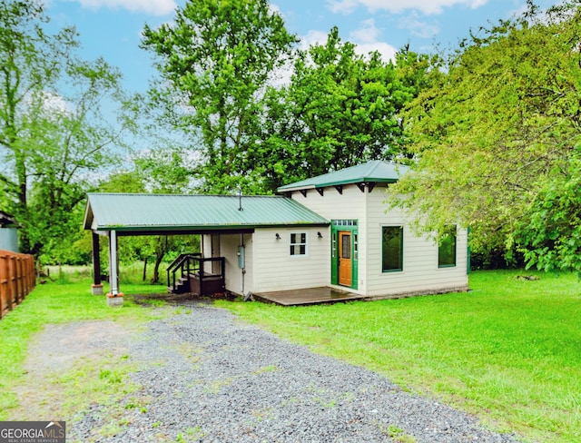 5198 Hwy 52 E, Ellijay, GA 30536 - view of front of home with a wooden deck, gravel driveway, metal roof, and a carport