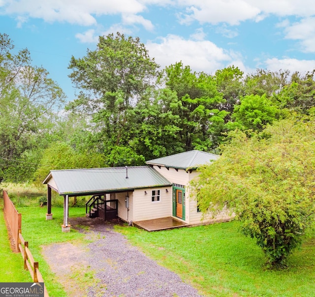 5198 Hwy 52 E, Ellijay, GA 30536 - view of front of home featuring a front yard, driveway, a wooden deck, and metal roof