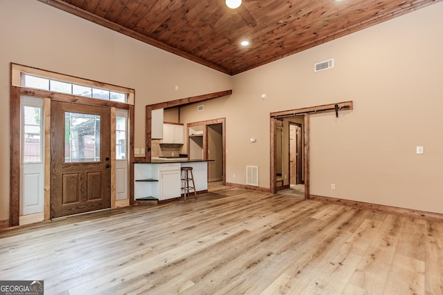5198 Hwy 52 E, Ellijay, GA 30536 - entryway with wood ceiling, light wood-style flooring, a high ceiling, baseboards, and ornamental molding