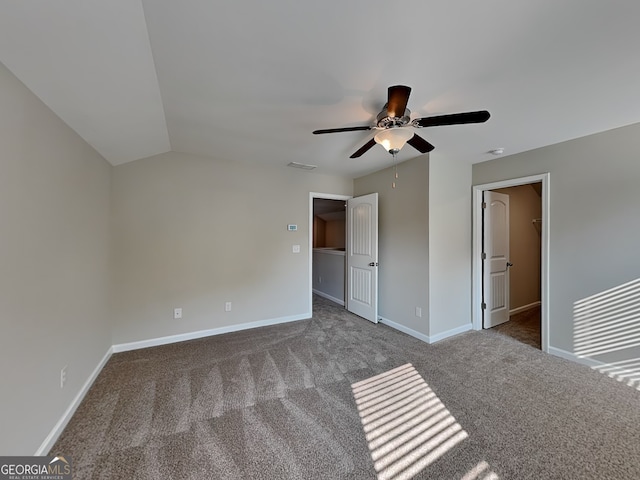 471 Lanier Ct, Hiram, GA 30141 - unfurnished bedroom with carpet flooring, a spacious closet, baseboards, a ceiling fan, and lofted ceiling