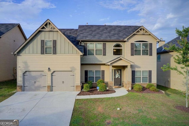 3746 Okefenokee Rdg, Loganville, GA 30052 - craftsman house with board and batten siding, concrete driveway, a front lawn, an attached garage, and stone siding