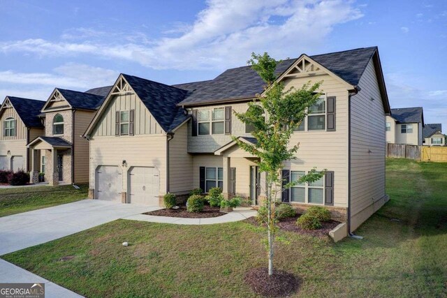 3746 Okefenokee Rdg, Loganville, GA 30052 - view of front of property featuring board and batten siding, concrete driveway, and a garage