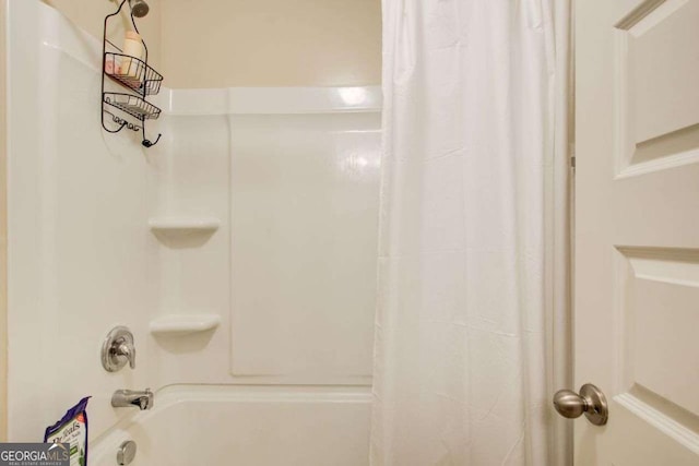 3746 Okefenokee Rdg, Loganville, GA 30052 - bathroom featuring shower / tub combo with curtain
