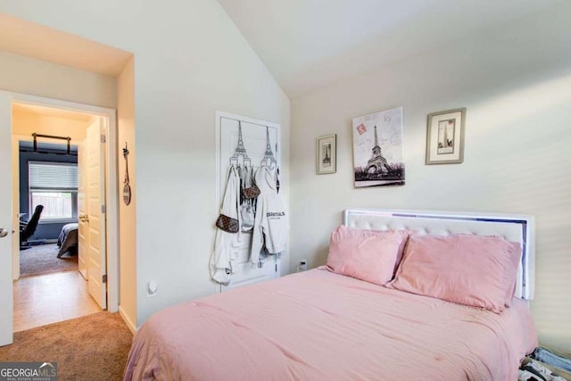 3746 Okefenokee Rdg, Loganville, GA 30052 - carpeted bedroom with lofted ceiling and a closet