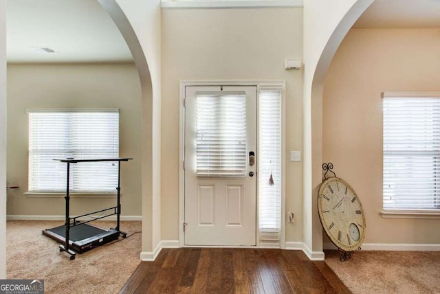 3746 Okefenokee Rdg, Loganville, GA 30052 - entrance foyer featuring wood finished floors and arched walkways