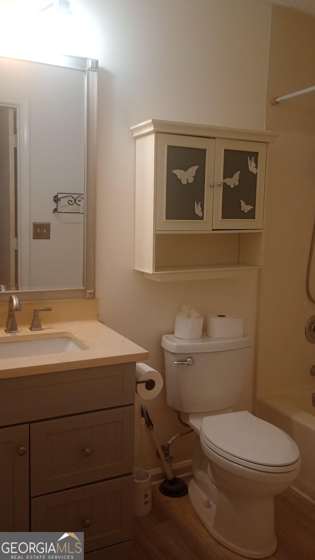 61 Maxie Ln, Dallas, GA 30157 - full bath with vanity, wood finished floors, and washtub / shower combination