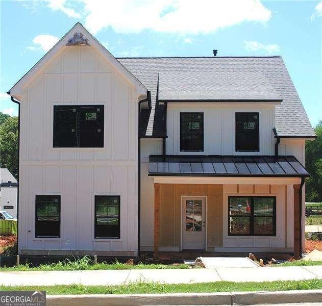 125 Old Alabama Rd, Emerson, GA 30137 - modern farmhouse with board and batten siding, a standing seam roof, roof with shingles, and covered porch