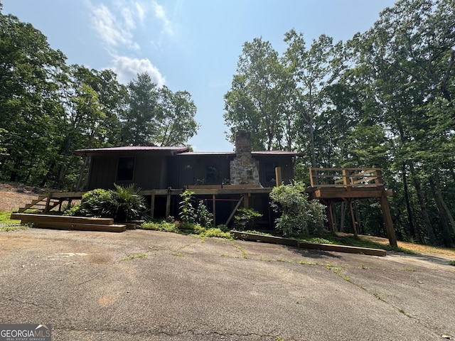 427 Bakers Fiord, Sautee Nacoochee, GA 30571 - view of front of house with a chimney and a wooden deck