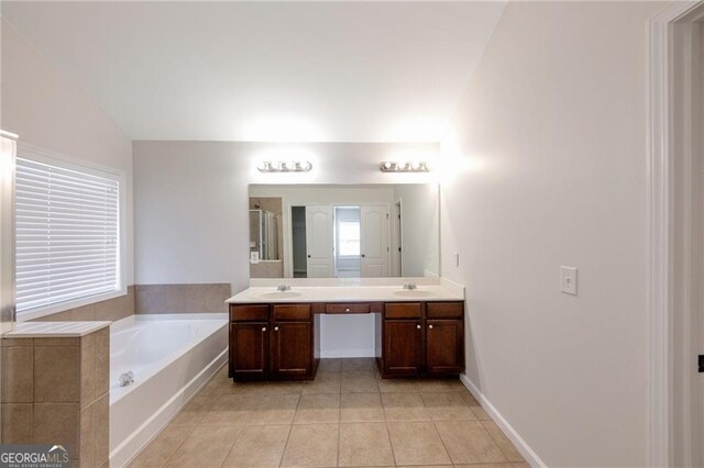 436 Crestmont Ln, Canton, GA 30114 - bathroom featuring double vanity, a garden tub, tile patterned flooring, a stall shower, and baseboards