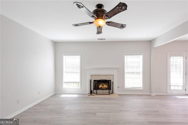 436 Crestmont Ln, Canton, GA 30114 - unfurnished living room featuring ceiling fan, a premium fireplace, light wood-style flooring, and baseboards
