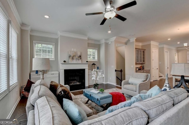 747 Topsail Ln, Alpharetta, GA 30005 - living area with a ceiling fan, dark wood finished floors, recessed lighting, a glass covered fireplace, and crown molding
