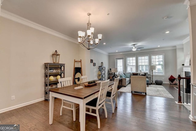 747 Topsail Ln, Alpharetta, GA 30005 - dining room with crown molding, ceiling fan, a chandelier, a fireplace, and recessed lighting