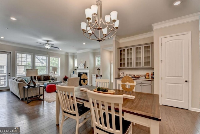 747 Topsail Ln, Alpharetta, GA 30005 - dining room featuring a ceiling fan, wood finished floors, crown molding, recessed lighting, and a chandelier