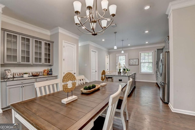 747 Topsail Ln, Alpharetta, GA 30005 - dining room featuring a chandelier, crown molding, dark wood finished floors, and recessed lighting
