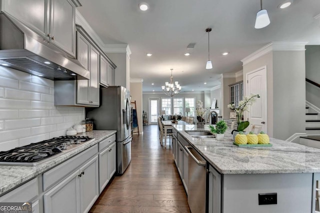 747 Topsail Ln, Alpharetta, GA 30005 - kitchen with stainless steel appliances, exhaust hood, crown molding, dark wood finished floors, and an island with sink