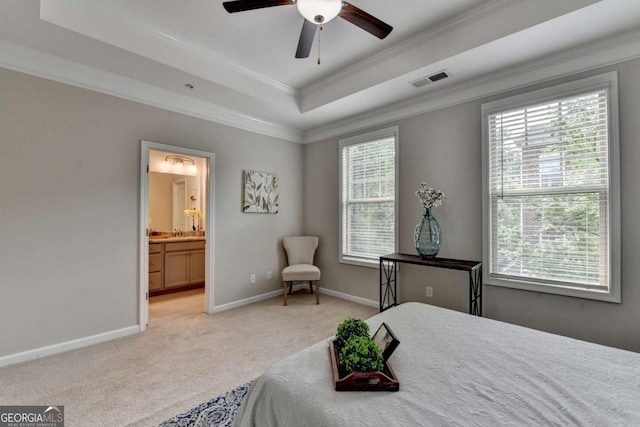 747 Topsail Ln, Alpharetta, GA 30005 - bedroom with light colored carpet, crown molding, a tray ceiling, connected bathroom, and ceiling fan