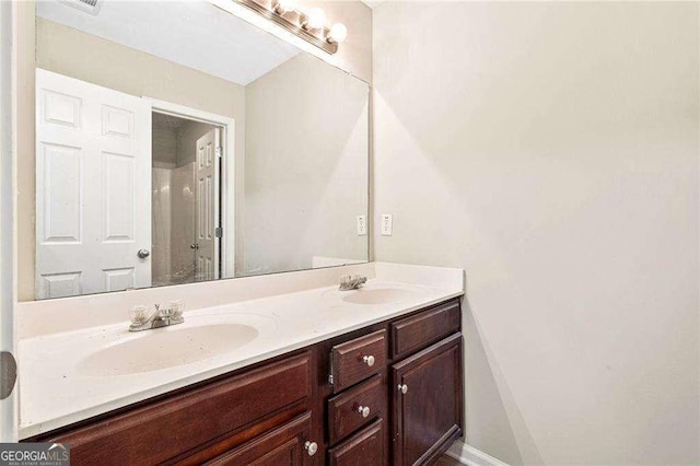 124 Granite Way, Newnan, GA 30265 - bathroom featuring double vanity and a shower