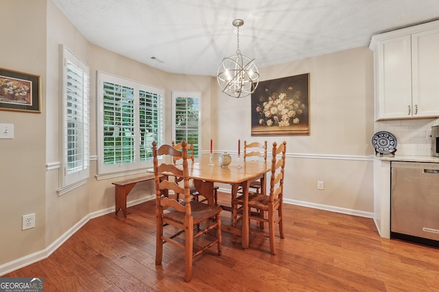 412 Rock Creek Dr, Peachtree City, GA 30269 - dining space featuring light wood-style flooring, a chandelier, and baseboards