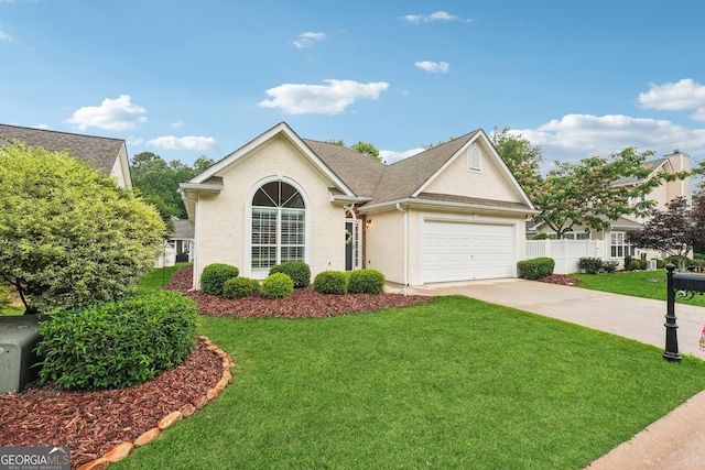 412 Rock Creek Dr, Peachtree City, GA 30269 - view of front of home featuring driveway, stucco siding, and an attached garage