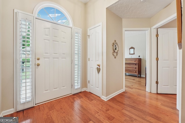 412 Rock Creek Dr, Peachtree City, GA 30269 - foyer with light wood-style flooring, healthy amount of natural light, and baseboards