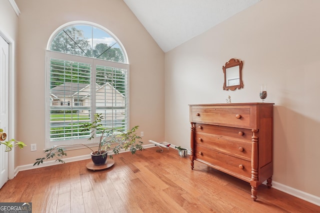 412 Rock Creek Dr, Peachtree City, GA 30269 - sitting room featuring light wood finished floors, high vaulted ceiling, and baseboards