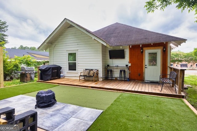 575 E Main St, Buford, GA 30518 - back of house with a deck, a shingled roof, a lawn, and a patio area