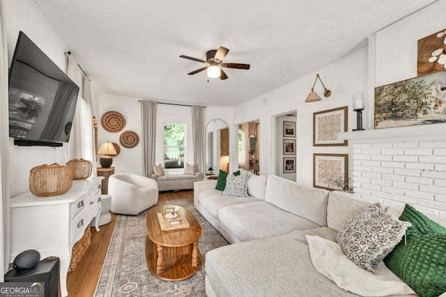575 E Main St, Buford, GA 30518 - living room featuring ceiling fan and wood finished floors