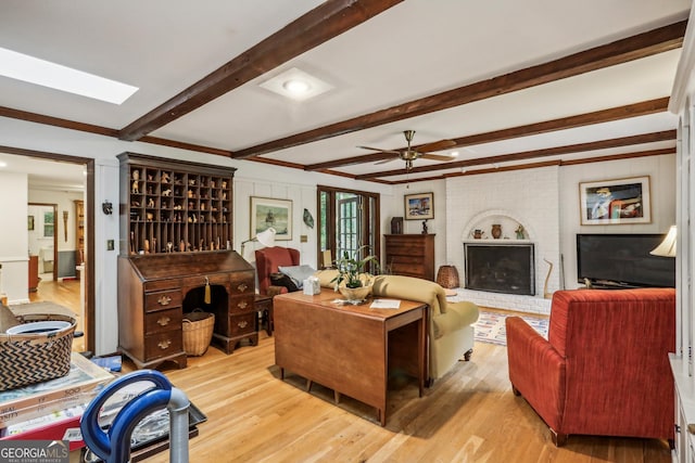 2700 Regency Dr E, Tucker, GA 30084 - living area featuring wood finished floors, ceiling fan, beam ceiling, and crown molding