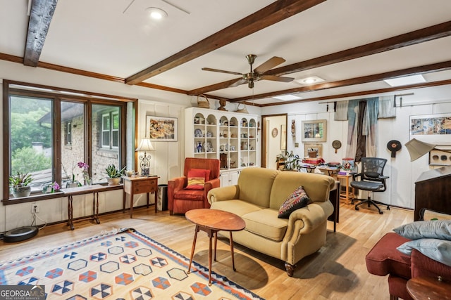 2700 Regency Dr E, Tucker, GA 30084 - living room featuring a ceiling fan, light wood-style flooring, beam ceiling, and ornamental molding