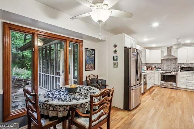 2700 Regency Dr E, Tucker, GA 30084 - dining area featuring a ceiling fan, light wood-type flooring, and recessed lighting