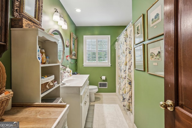 2700 Regency Dr E, Tucker, GA 30084 - bathroom with vanity, toilet, tile patterned flooring, baseboards, and recessed lighting