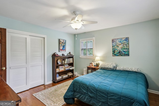 2700 Regency Dr E, Tucker, GA 30084 - bedroom featuring a closet, wood finished floors, a ceiling fan, and baseboards