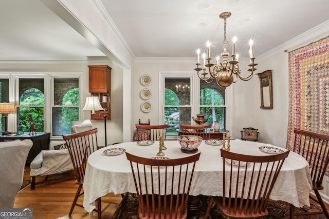 2700 Regency Dr E, Tucker, GA 30084 - dining room with a chandelier, crown molding, healthy amount of natural light, and wood finished floors