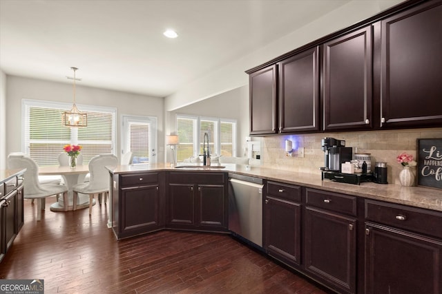 4965 Brierstone Dr, Alpharetta, GA 30004 - kitchen with stainless steel dishwasher, a sink, decorative backsplash, dark brown cabinetry, and plenty of natural light
