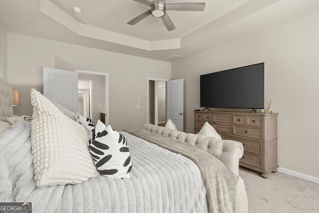 4965 Brierstone Dr, Alpharetta, GA 30004 - bedroom featuring light colored carpet, a tray ceiling, and ceiling fan