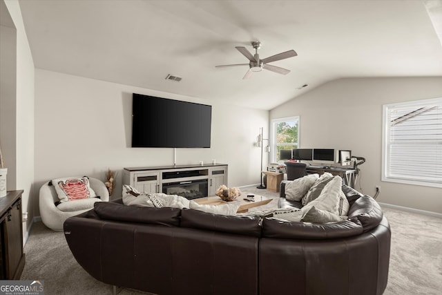 4965 Brierstone Dr, Alpharetta, GA 30004 - carpeted living room featuring lofted ceiling, ceiling fan, and baseboards