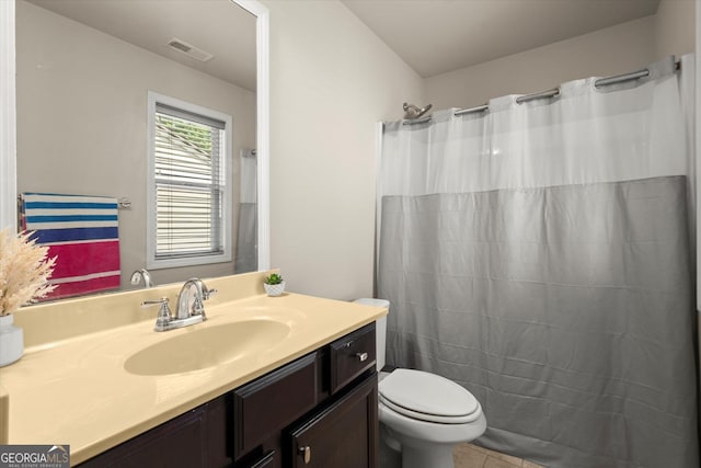 4965 Brierstone Dr, Alpharetta, GA 30004 - full bathroom featuring vanity, toilet, tile patterned flooring, and a shower with curtain