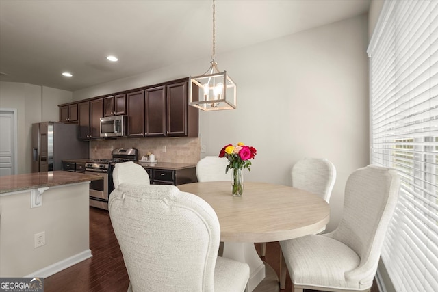 4965 Brierstone Dr, Alpharetta, GA 30004 - dining space featuring dark wood-style flooring, healthy amount of natural light, recessed lighting, and baseboards