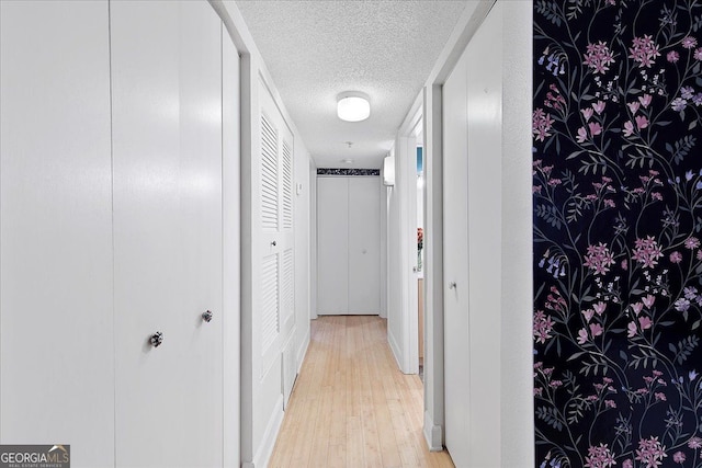 387 Ralph Mcgill Blvd NE Unit K, Atlanta, GA 30312 - corridor featuring a textured ceiling and light wood-style flooring