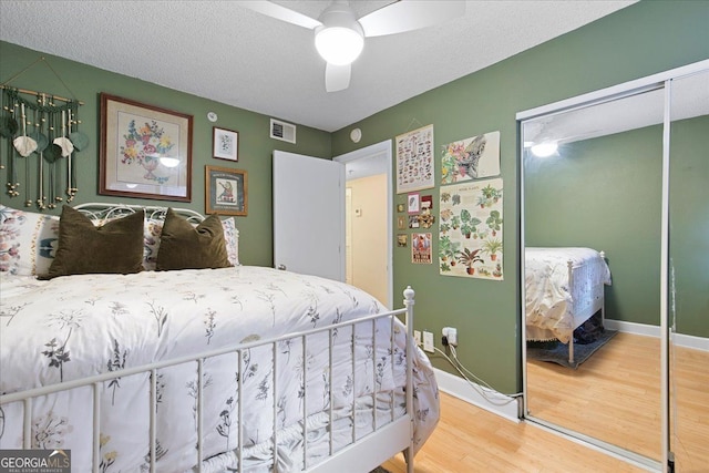 387 Ralph Mcgill Blvd NE Unit K, Atlanta, GA 30312 - bedroom with a closet, wood finished floors, and a ceiling fan